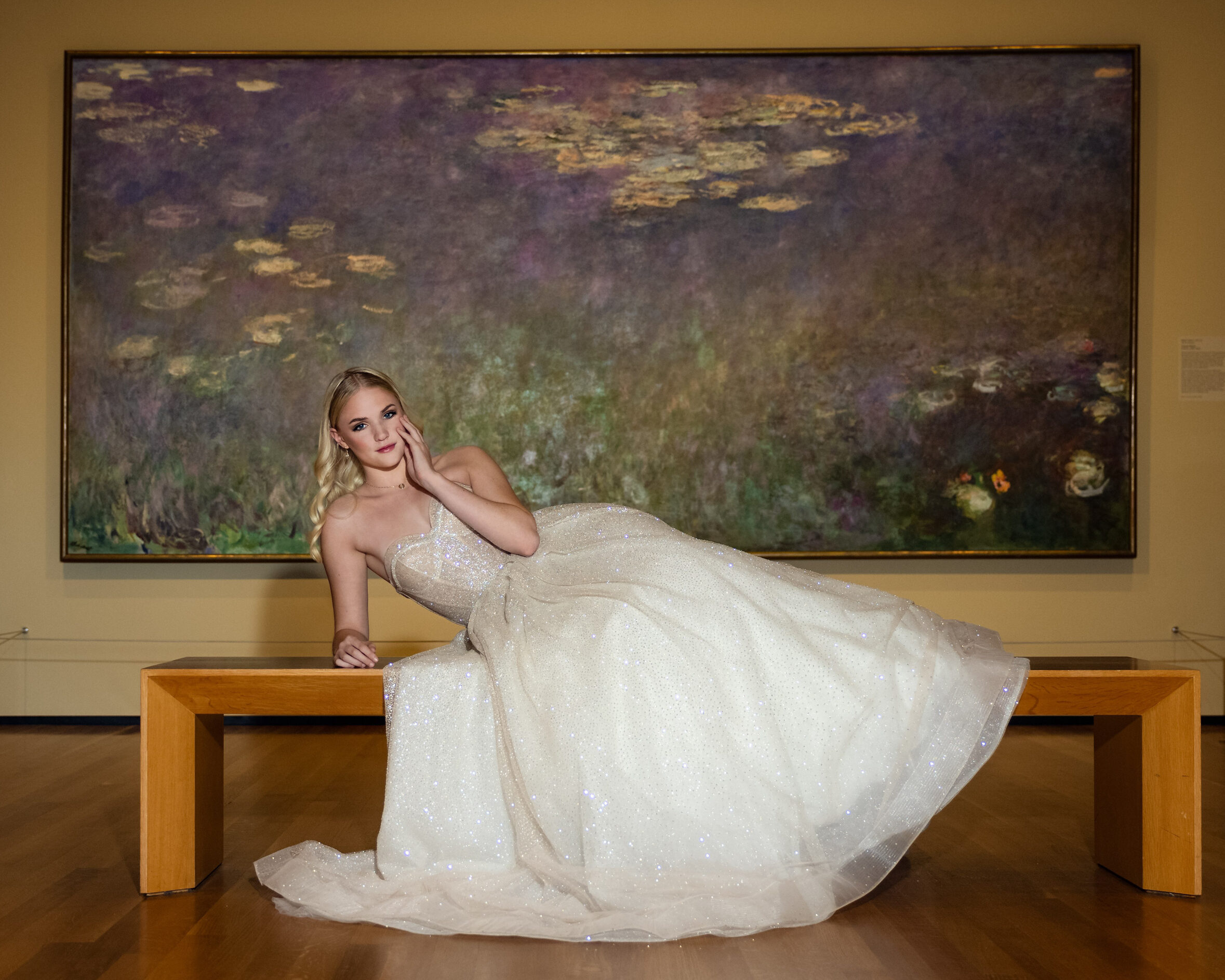 Beachwood High School Senior Girl modeling a champagne colored Pollardi gown during a senior session at the Cleveland Museum of Art